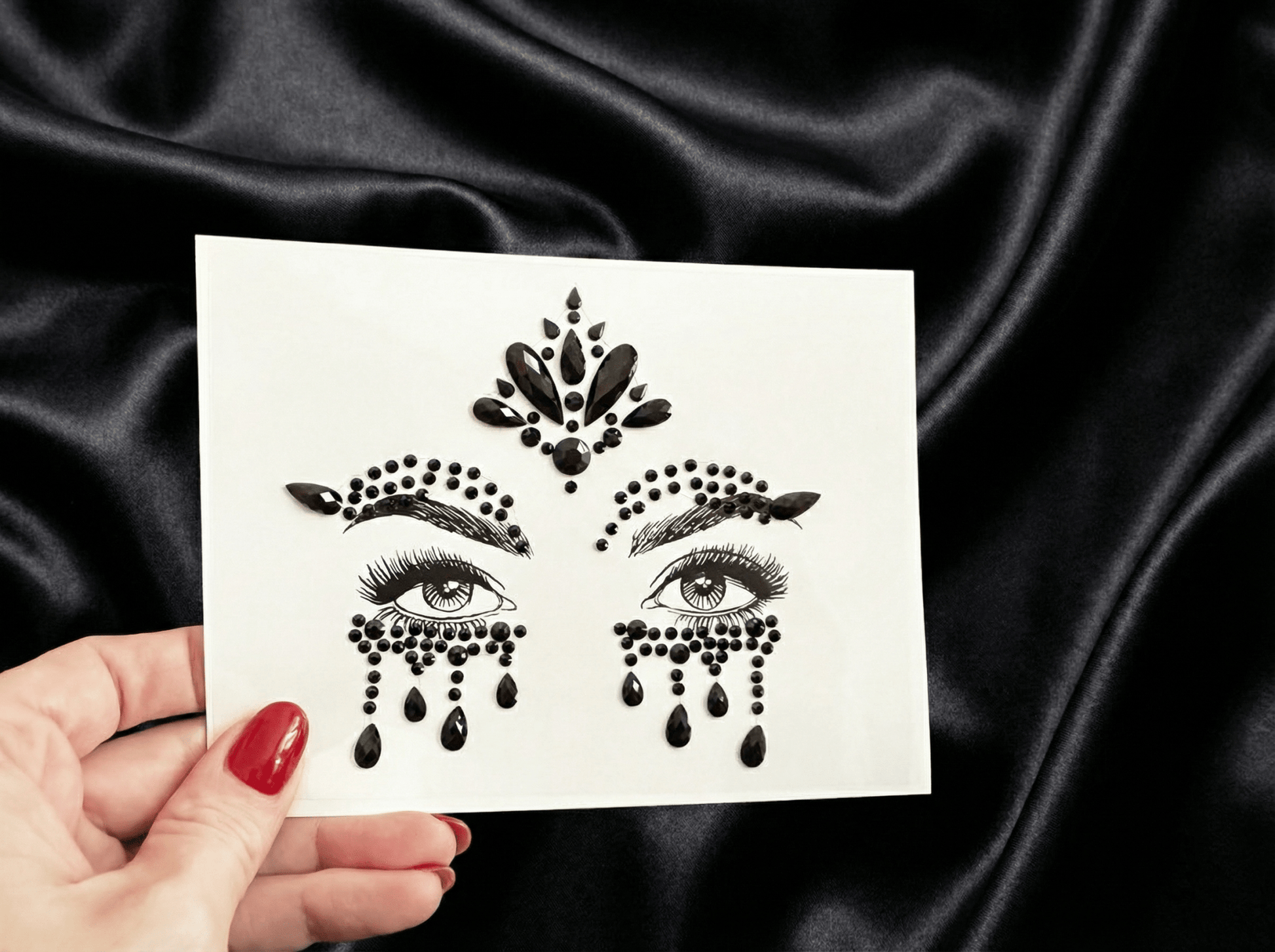 black halloween face gems in hand
